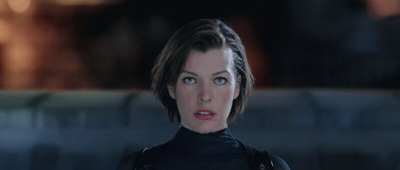 woman in black suit looking forward