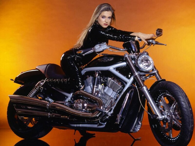 woman in black suit on motorcycle