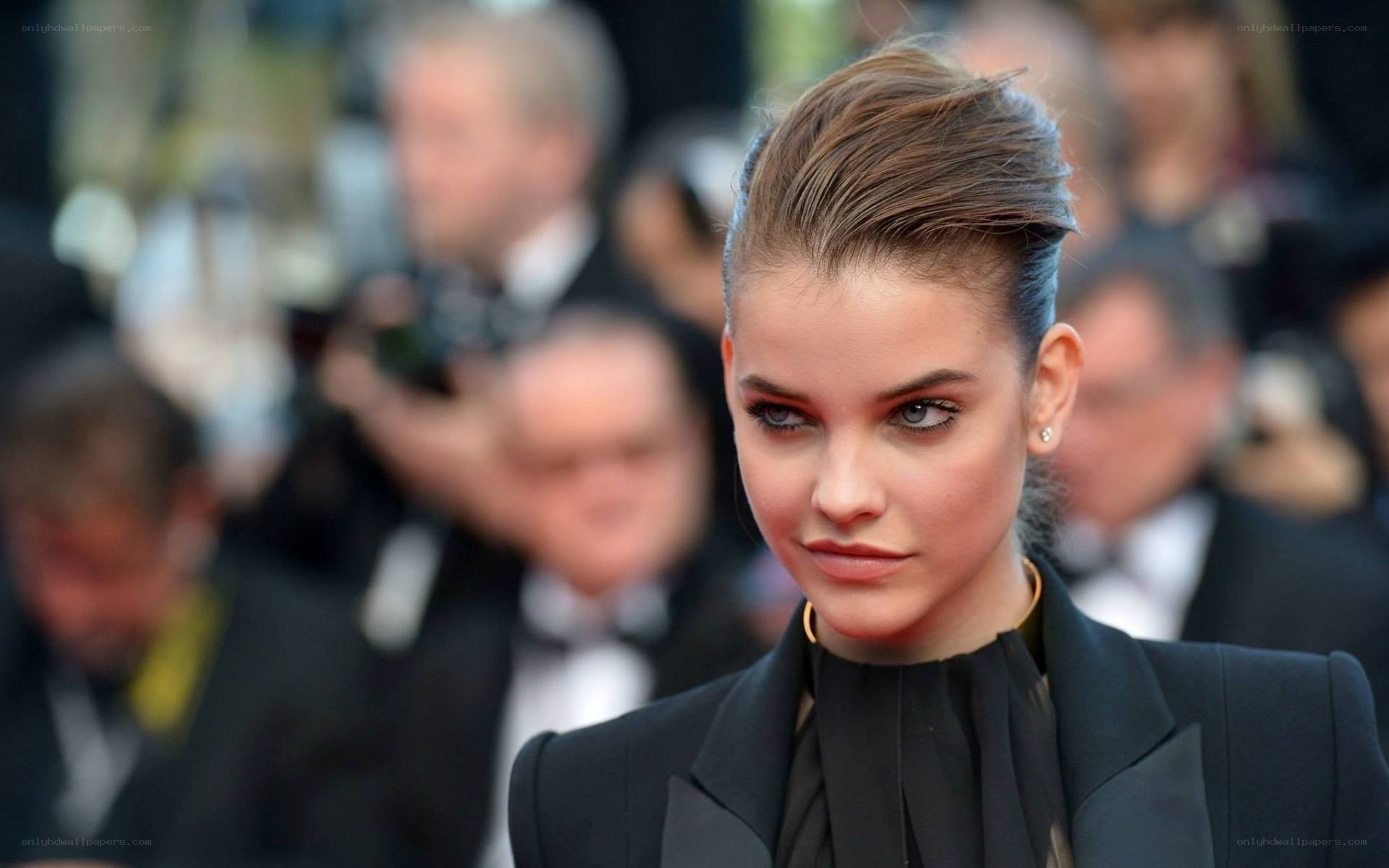 woman in black suit on red carpet