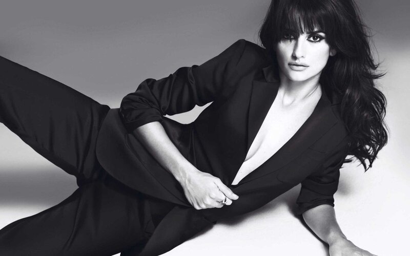 woman in black suit posing