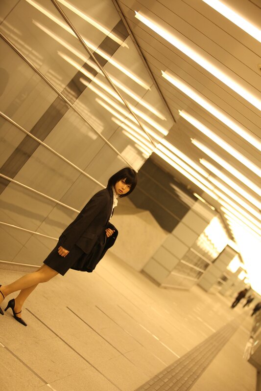 woman in black suit posing