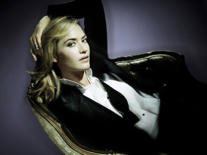 woman in black suit posing