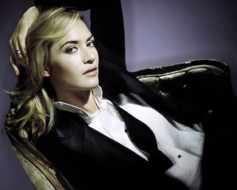 woman in black suit posing