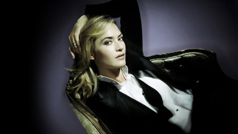 woman in black suit posing