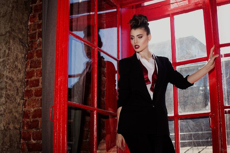 Woman in Black Suit — Red, Dramatic, Photograph, Red Phone Booth