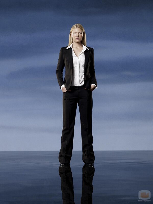 woman in black suit standing
