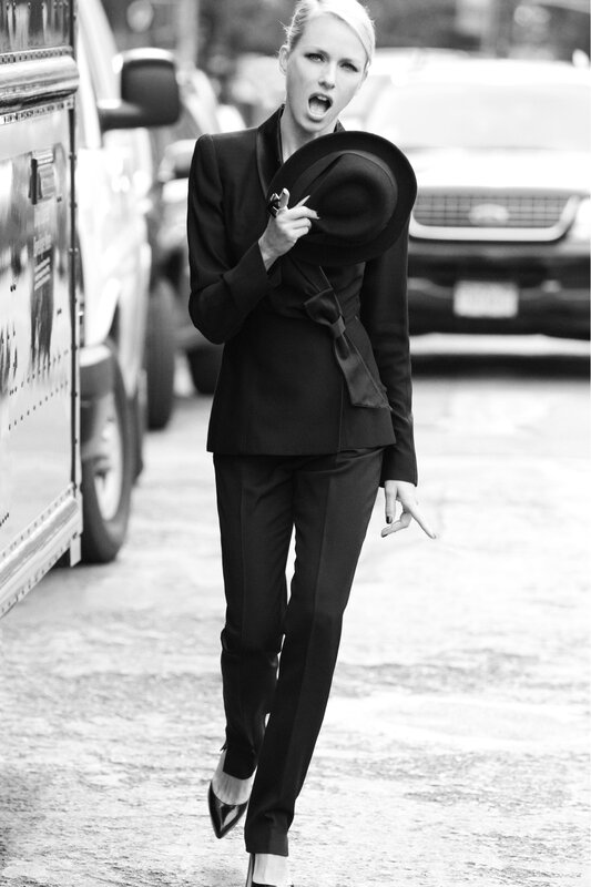 woman in black suit walking