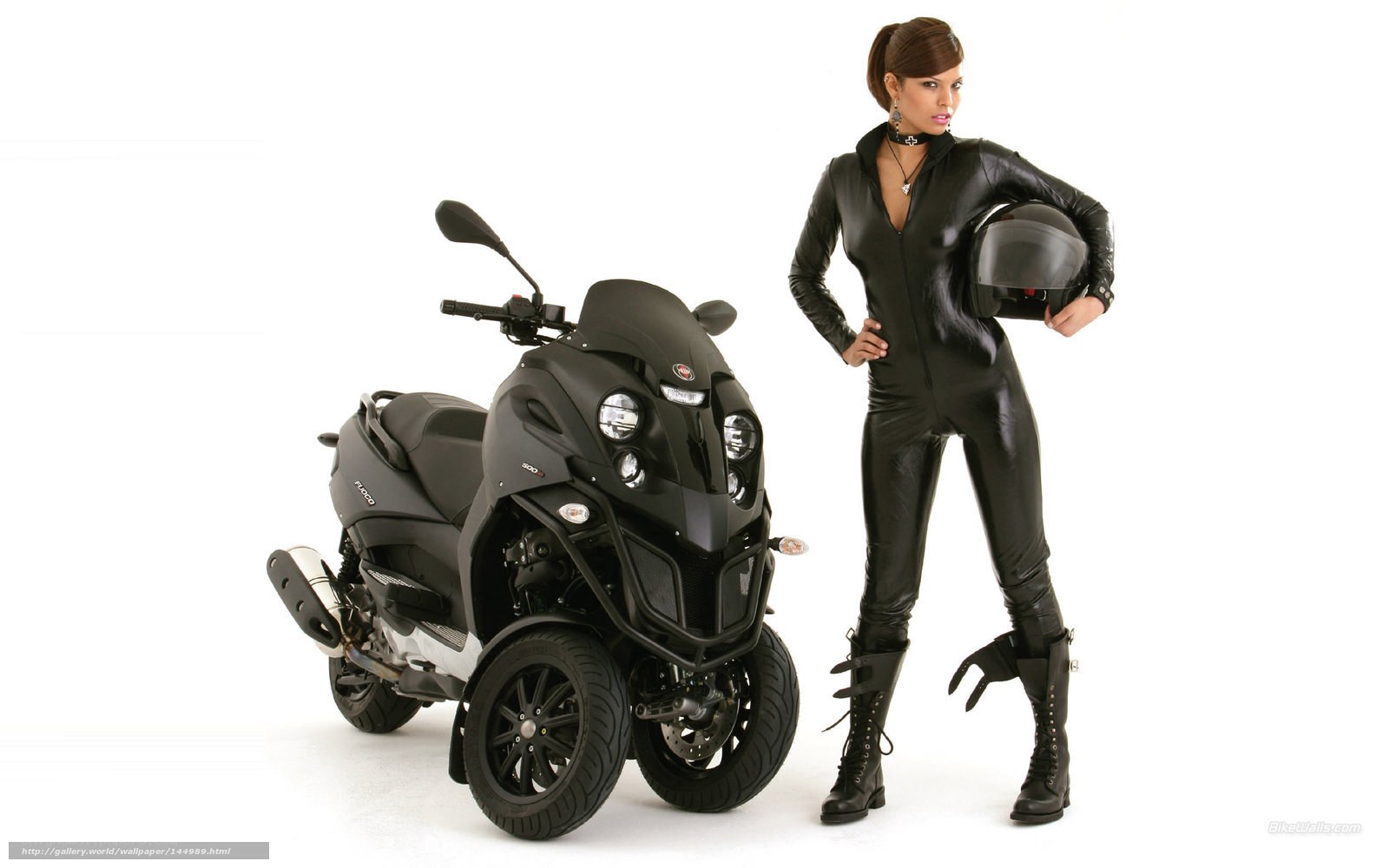 woman in black suit with scooter