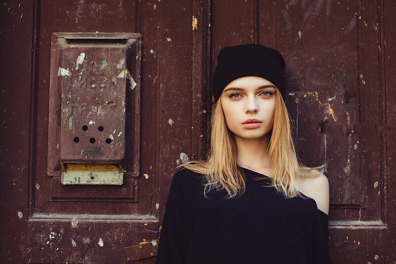 Woman in Black Sweater — Serious