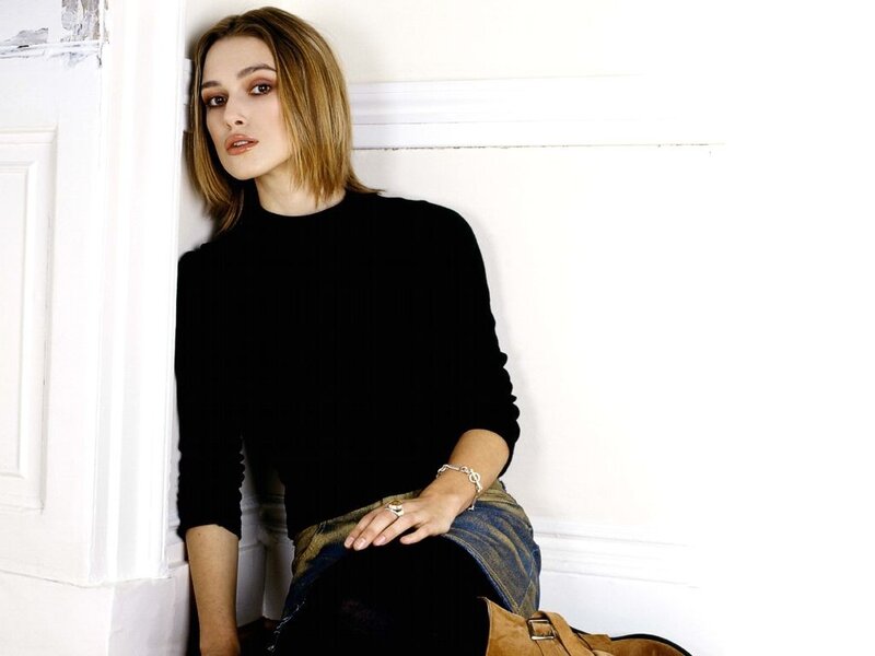 woman in black sweater sitting