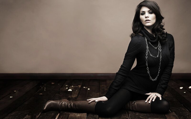 woman in black sweater sitting