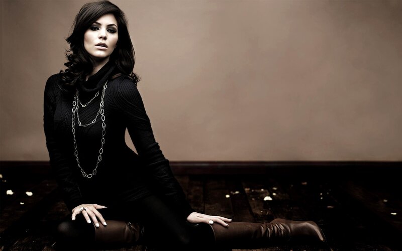 woman in black sweater sitting