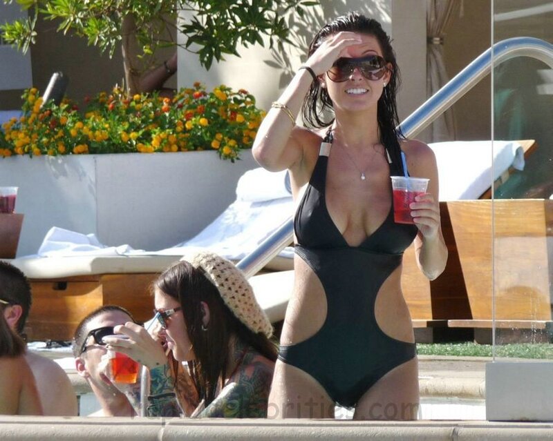 Woman in black swimsuit at pool