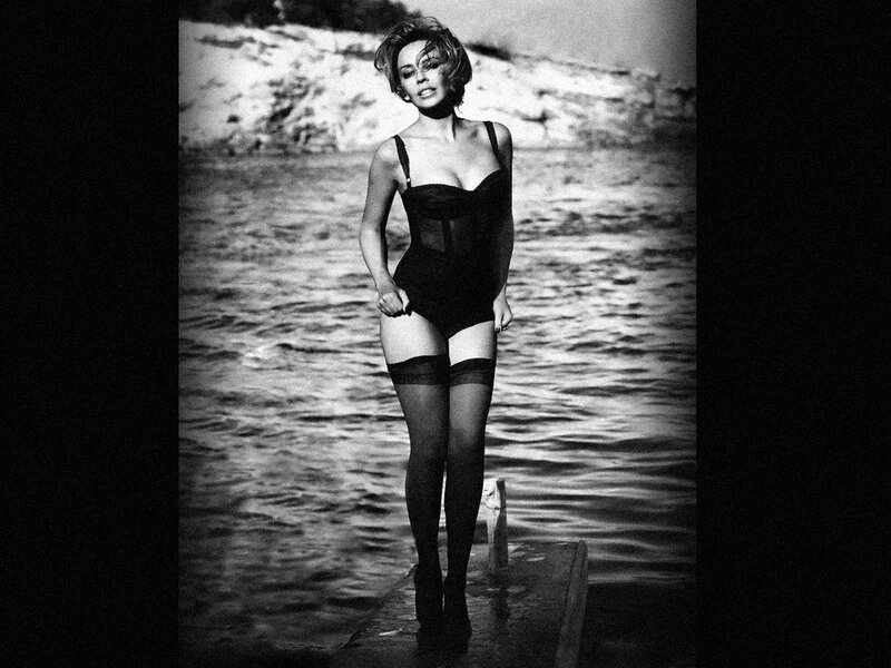 woman in black swimsuit on dock