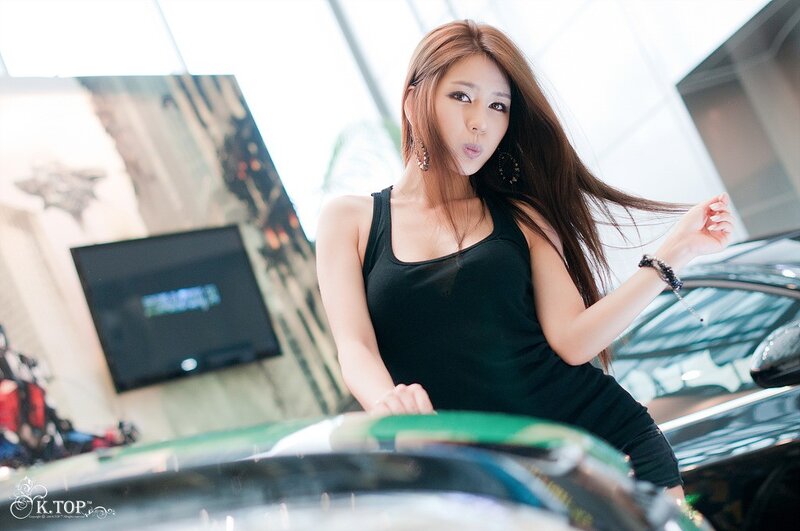 Woman in Black Tank Top — Confident, Photograph, Car