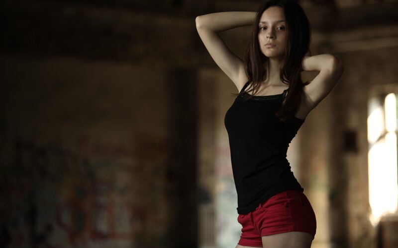 Woman in Black Tank Top — Dramatic, Photograph, Red Shorts