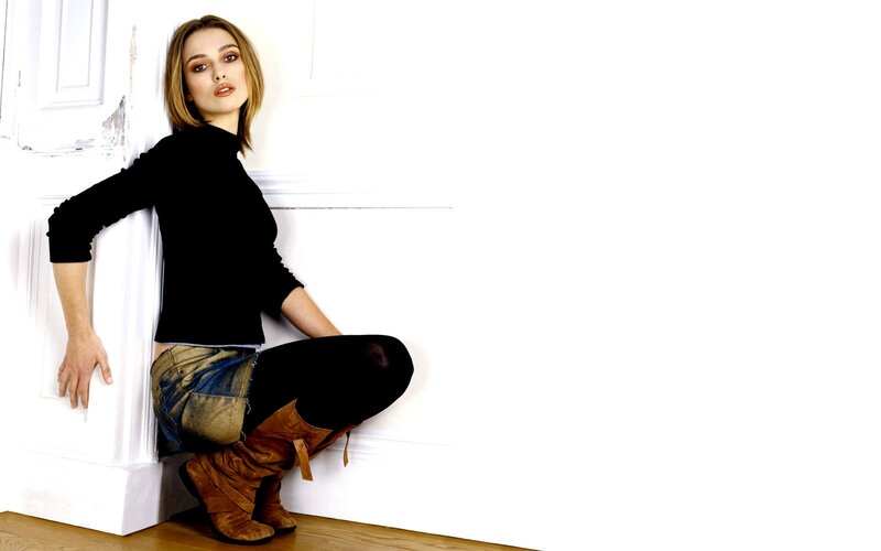 woman in black top and boots