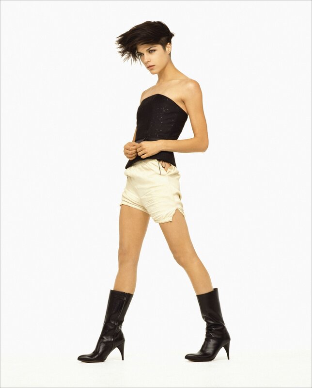 woman in black top and boots