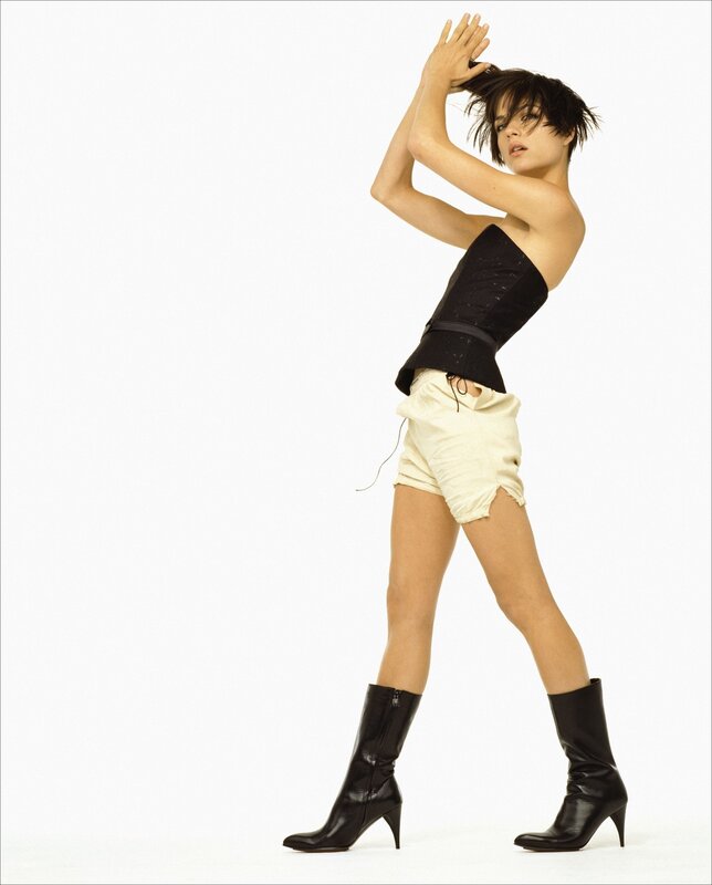 woman in black top and boots