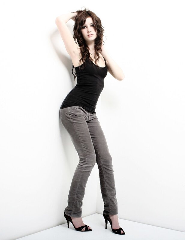 woman in black top and gray pants