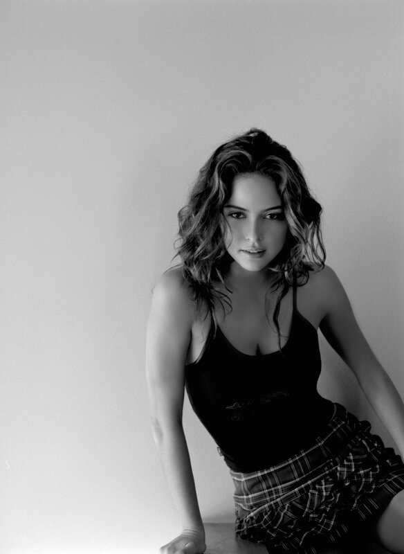 woman in black top and plaid skirt