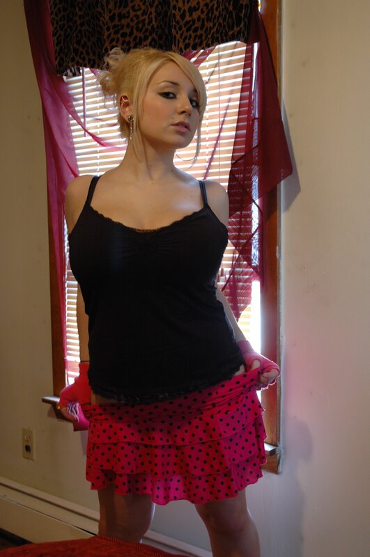 woman in black top and polka dot skirt