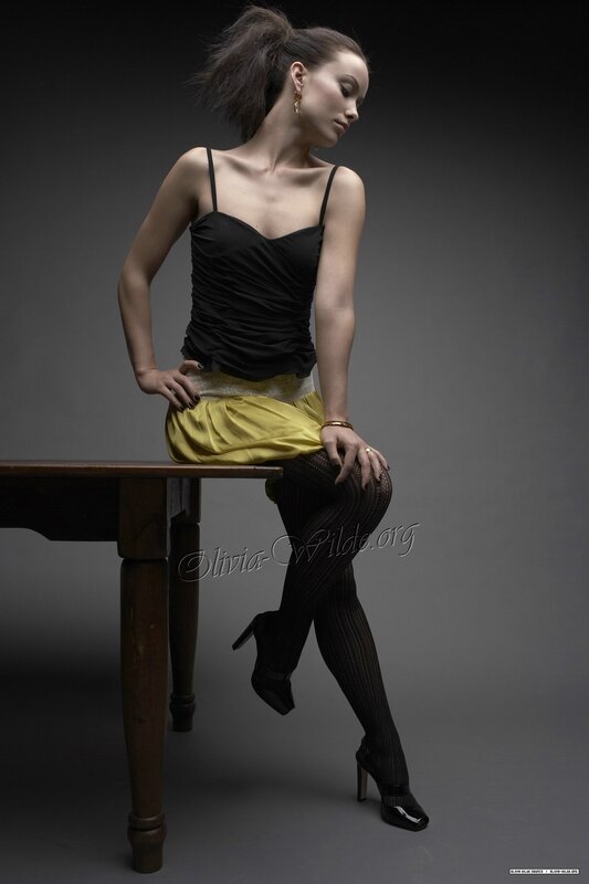 woman in black top and yellow skirt