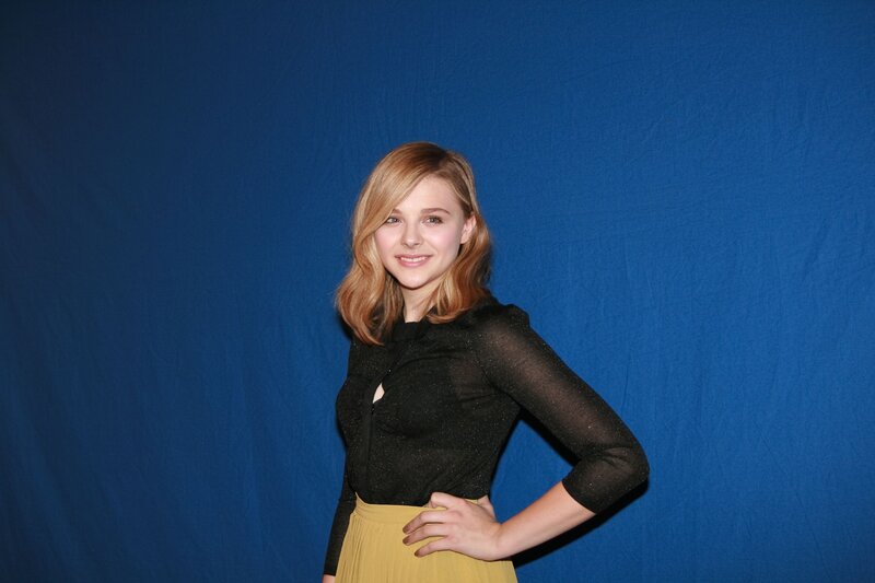 woman in black top and yellow skirt