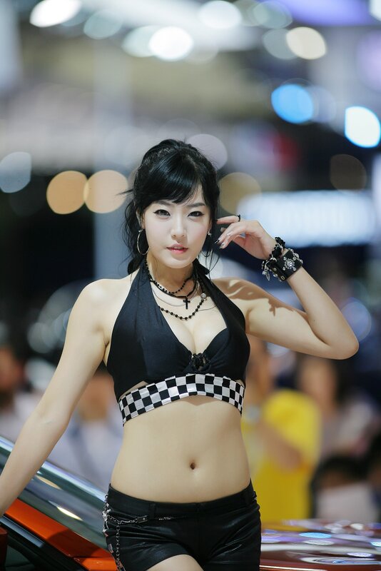 woman in black top at auto show