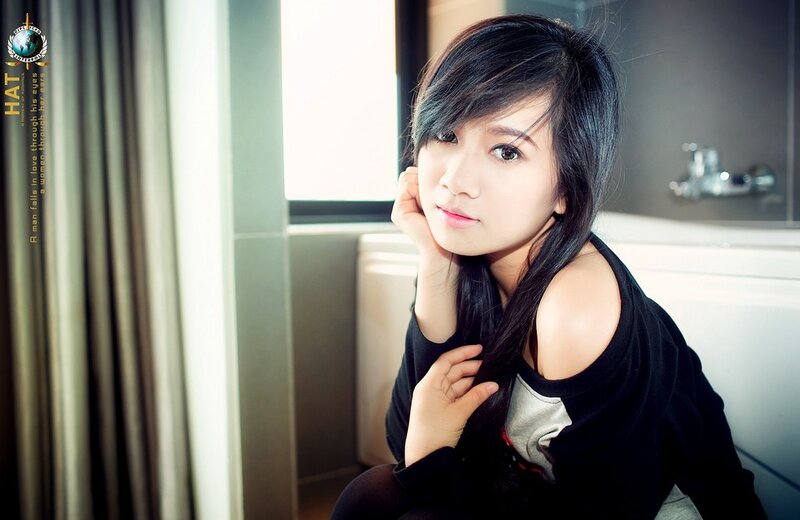 woman in black top by window