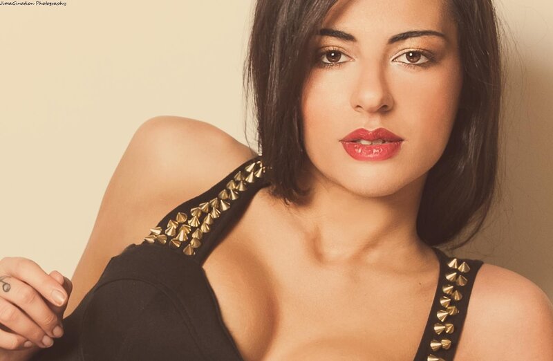 Woman in Black Top — Confident, Photograph, Black Top, Gold Studs