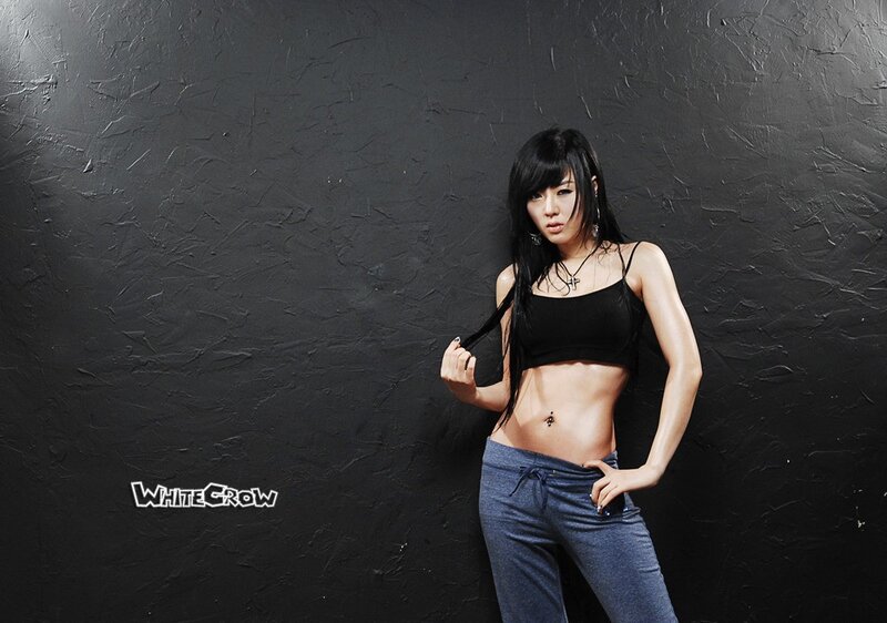 Woman in Black Top — Confident, Photograph, Black Wall