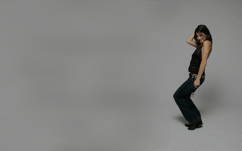 Woman in Black Top — Gray, Neutral, Photograph, Jeans