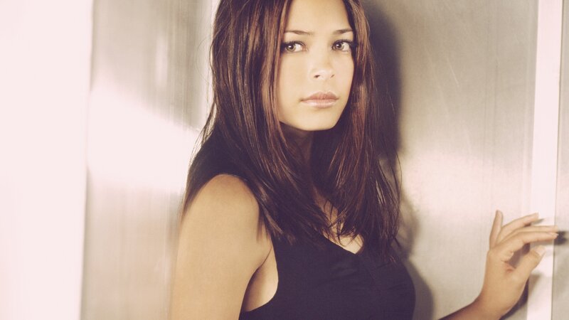 woman in black top leaning
