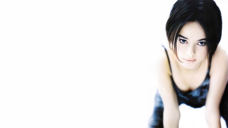 woman in black top looking at camera