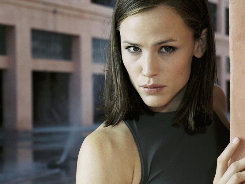 woman in black top looking at camera