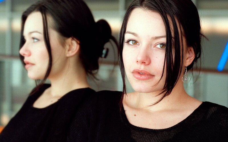 woman in black top looking at camera