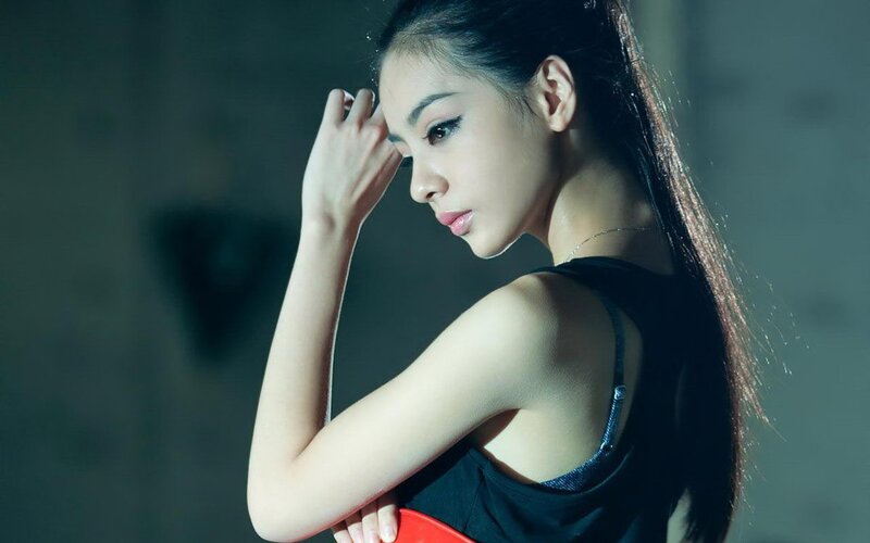 woman in black top looking down