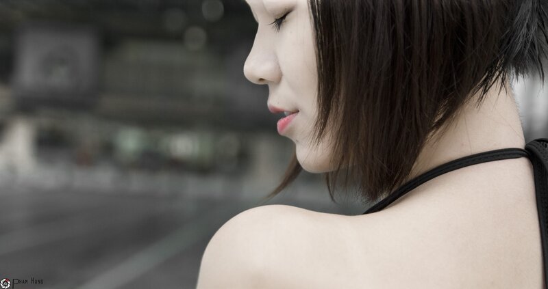 woman in black top looking down
