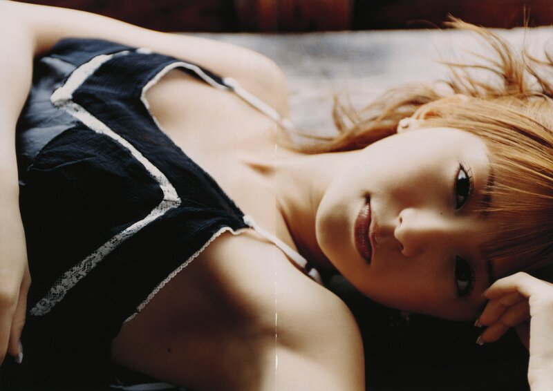 woman in black top lying down