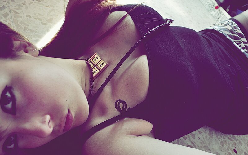 woman in black top lying down