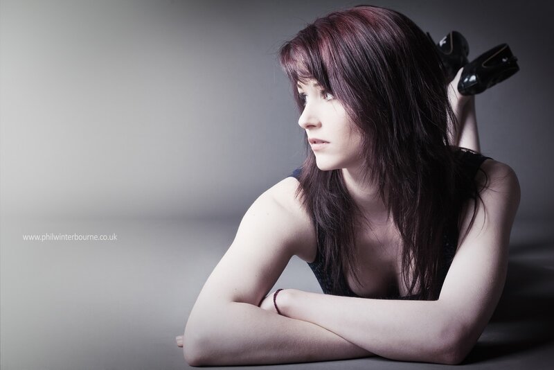woman in black top lying down