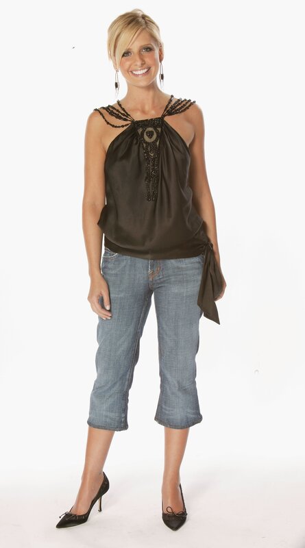 Woman in Black Top — Neutral, Photograph, Jeans, Heels