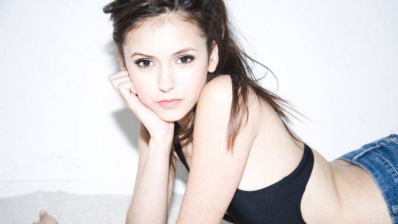 Woman in Black Top — Neutral, Photograph, Jeans, White Wall