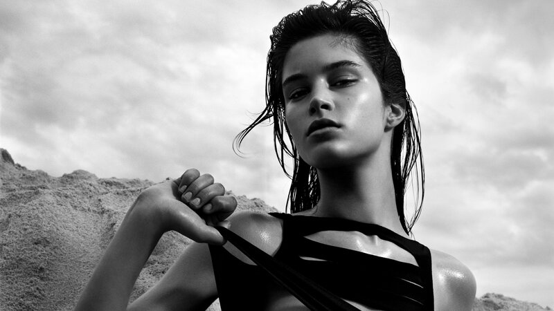 woman in black top on beach