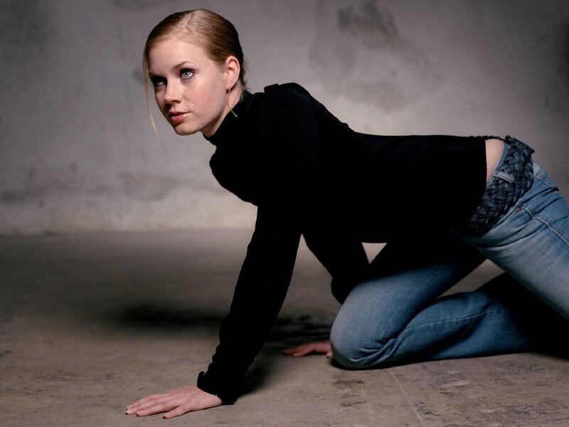 woman in black top on floor