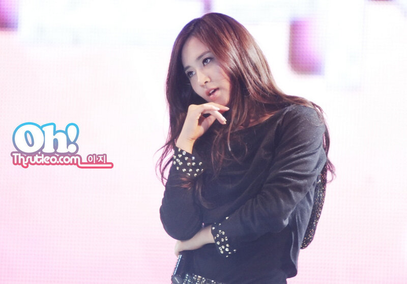 woman in black top on stage