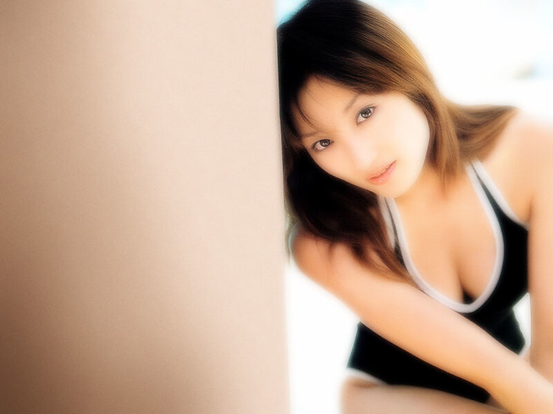 woman in black top peeking