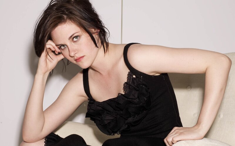 woman in black top posing
