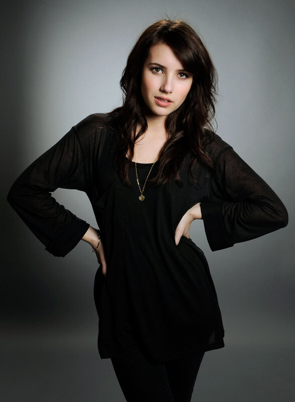 woman in black top posing